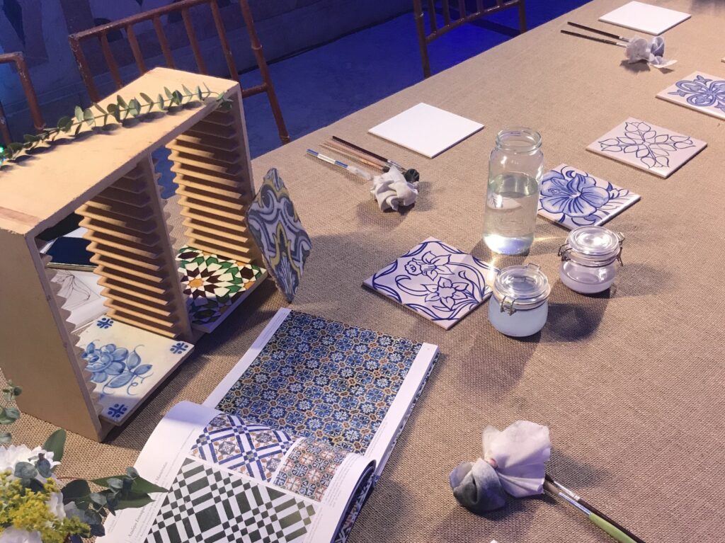 Guests experiencing traditional Portuguese tile art in a tailored hotel workshop for corporate and DMC personalized events