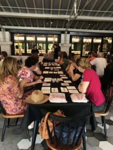 Community members painting traditional Portuguese tiles together in Lisbon