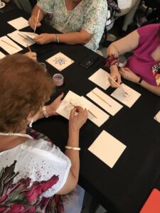 Participants collaborating on a local tile art workshop in Lisbon