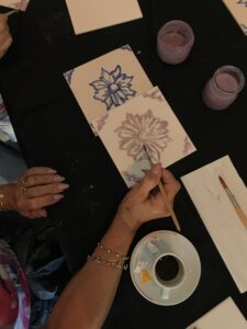 Participants collaborating on a local tile art workshop in Lisbon