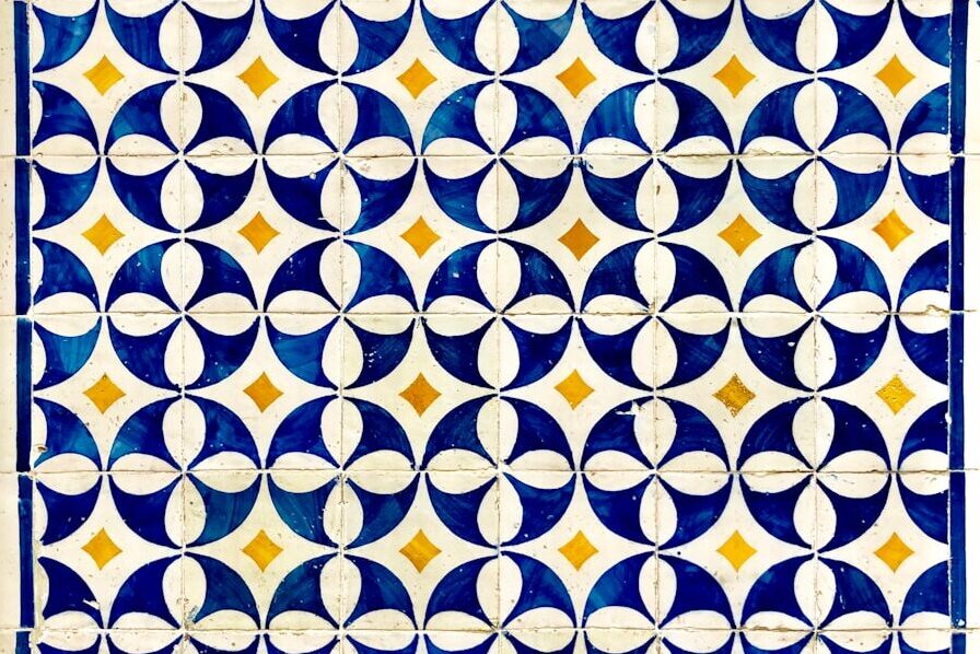 a blue and white tile with circles on it